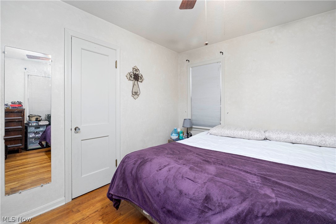 3305 Warren Road Cleveland, OH 44111 - Photo 22 of 28 Bedroom with ceiling fan and light wood-type flooring