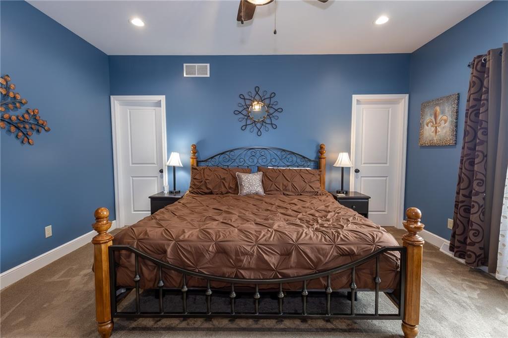 130 Parker Road Mercer, PA 16137 - Photo 22 of 50 a bedroom with a bed and wooden floor