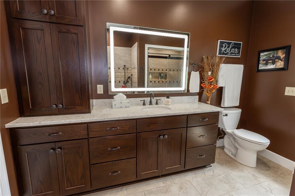 130 Parker Road Mercer, PA 16137 - Photo 25 of 50 a bathroom with a toilet sink and mirror