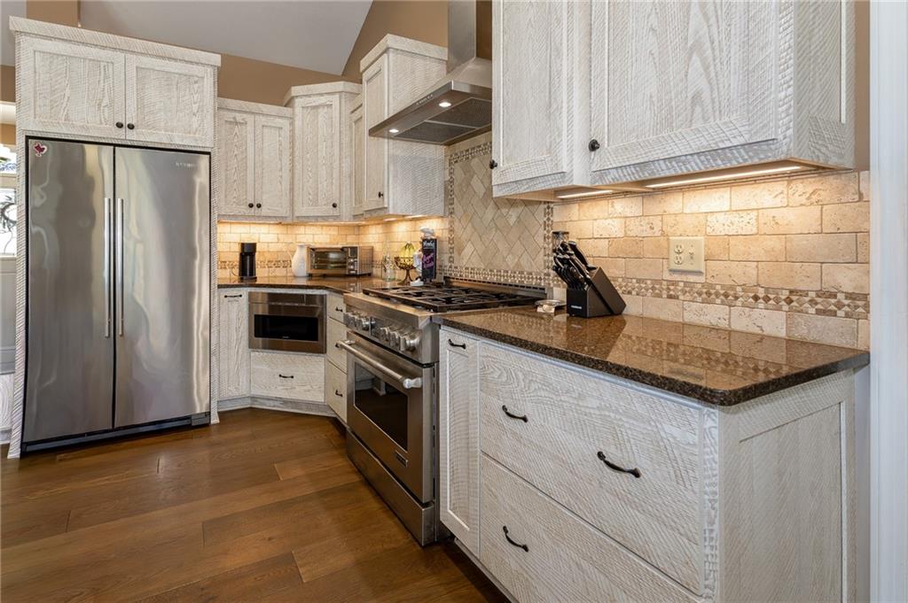 130 Parker Road Mercer, PA 16137 - Photo 7 of 50 a kitchen with granite countertop a sink stainless steel appliances and cabinets