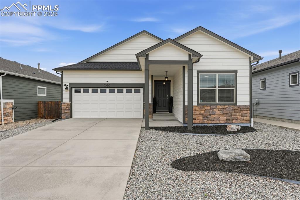 a front view of a house with garage