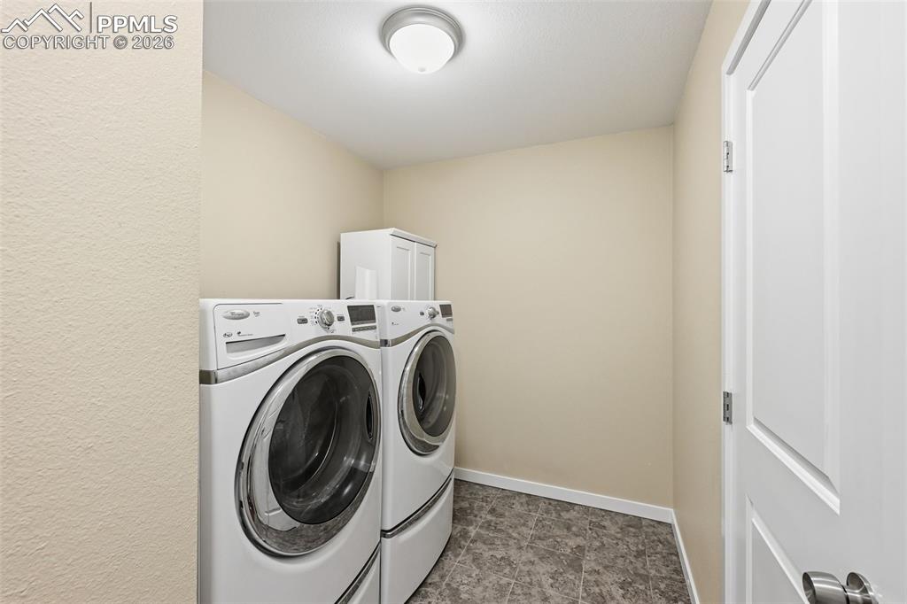 6565 Watusi Road Peyton, CO 80831 - Photo 12 of 36 a utility room with dryer and washer
