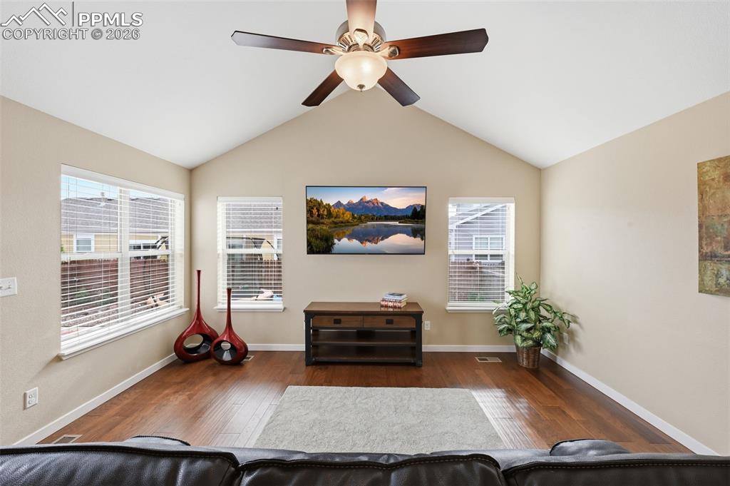6565 Watusi Road Peyton, CO 80831 - Photo 16 of 36 a living room with furniture and a flat screen tv