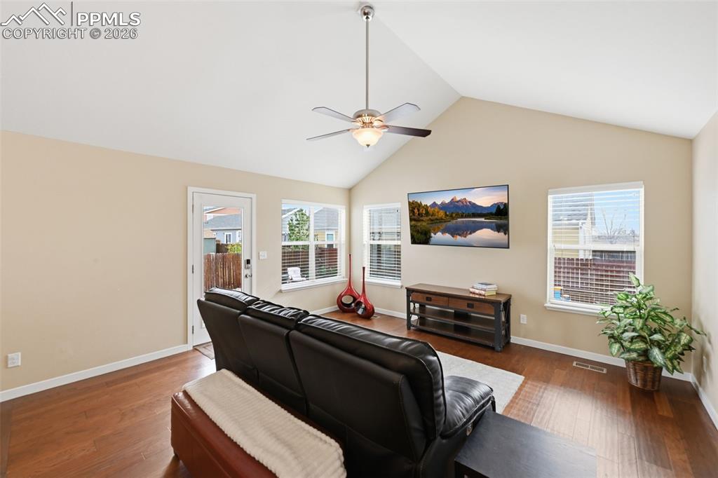 6565 Watusi Road Peyton, CO 80831 - Photo 17 of 36 a living room with furniture and a flat screen tv