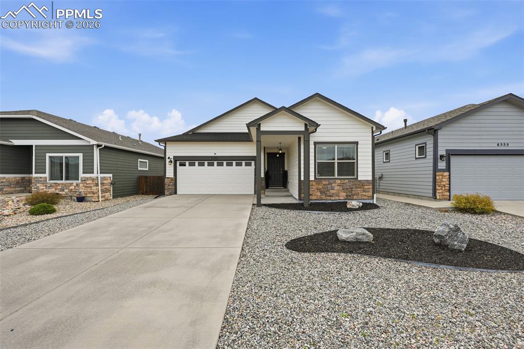 6565 Watusi Road Peyton, CO 80831 - Photo 2 of 36 a front view of a house with yard