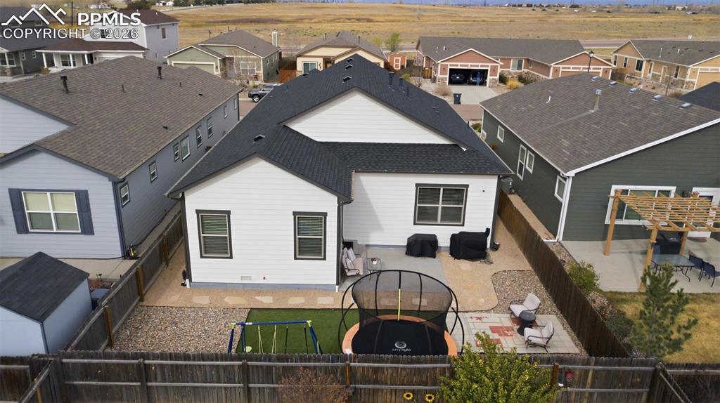 6565 Watusi Road Peyton, CO 80831 - Photo 33 of 36 a front view of house with yard space and seating area