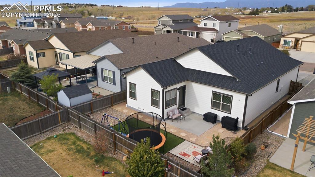 6565 Watusi Road Peyton, CO 80831 - Photo 34 of 36 an aerial view of residential houses with outdoor space and ocean view