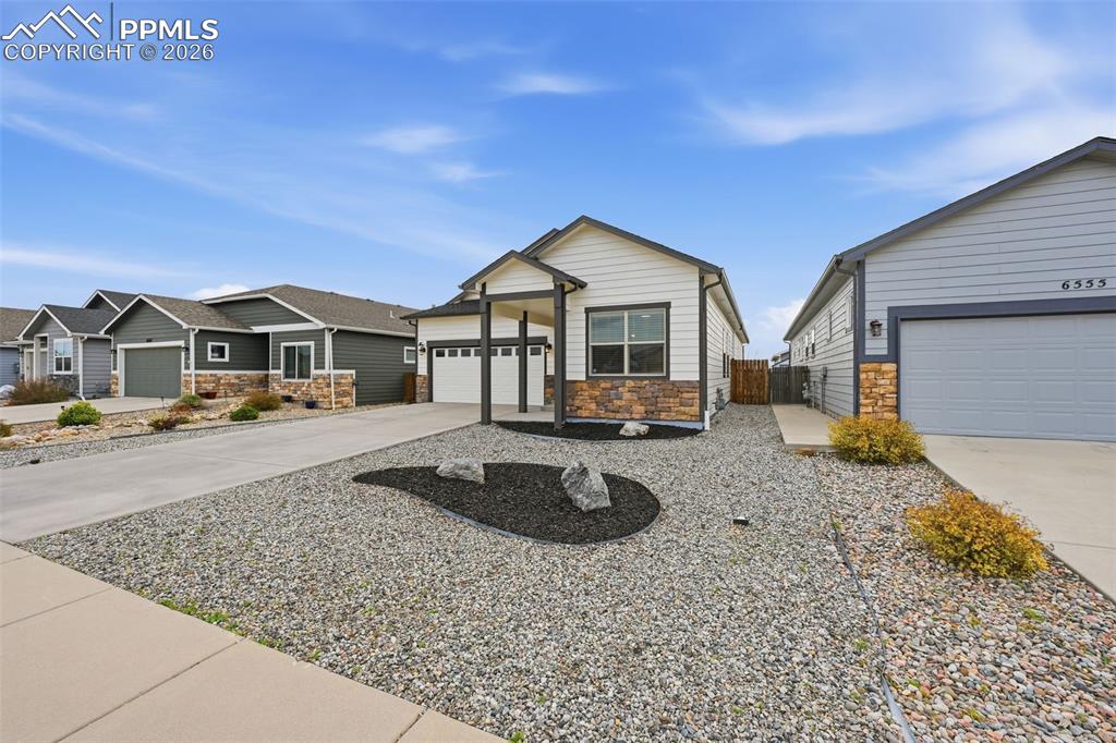 6565 Watusi Road Peyton, CO 80831 - Photo 5 of 36 a front view of a house with entertaining space