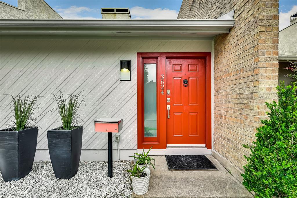 3624 Routh Street Dallas, TX 75219 - Photo 1 of 1 a potted plant in front of a door