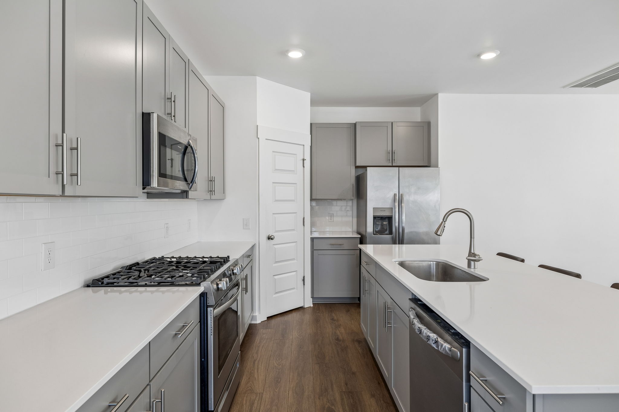 167 Harvest Point Boulevard Spring Hill, TN 37174 - Photo 24 of 55 a kitchen that has a sink and a stove