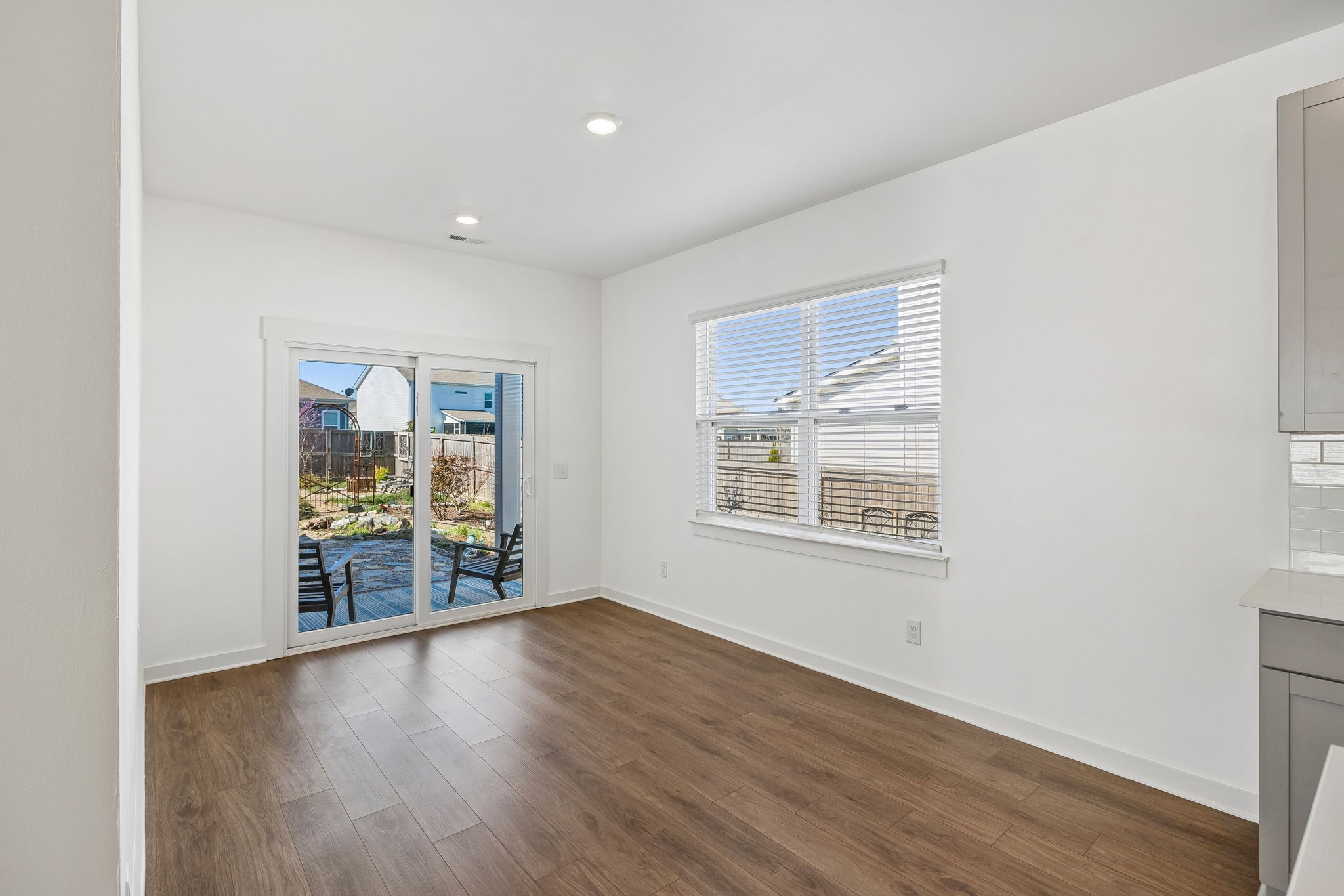 167 Harvest Point Boulevard Spring Hill, TN 37174 - Photo 25 of 55 a view of an empty room with wooden floor and a window