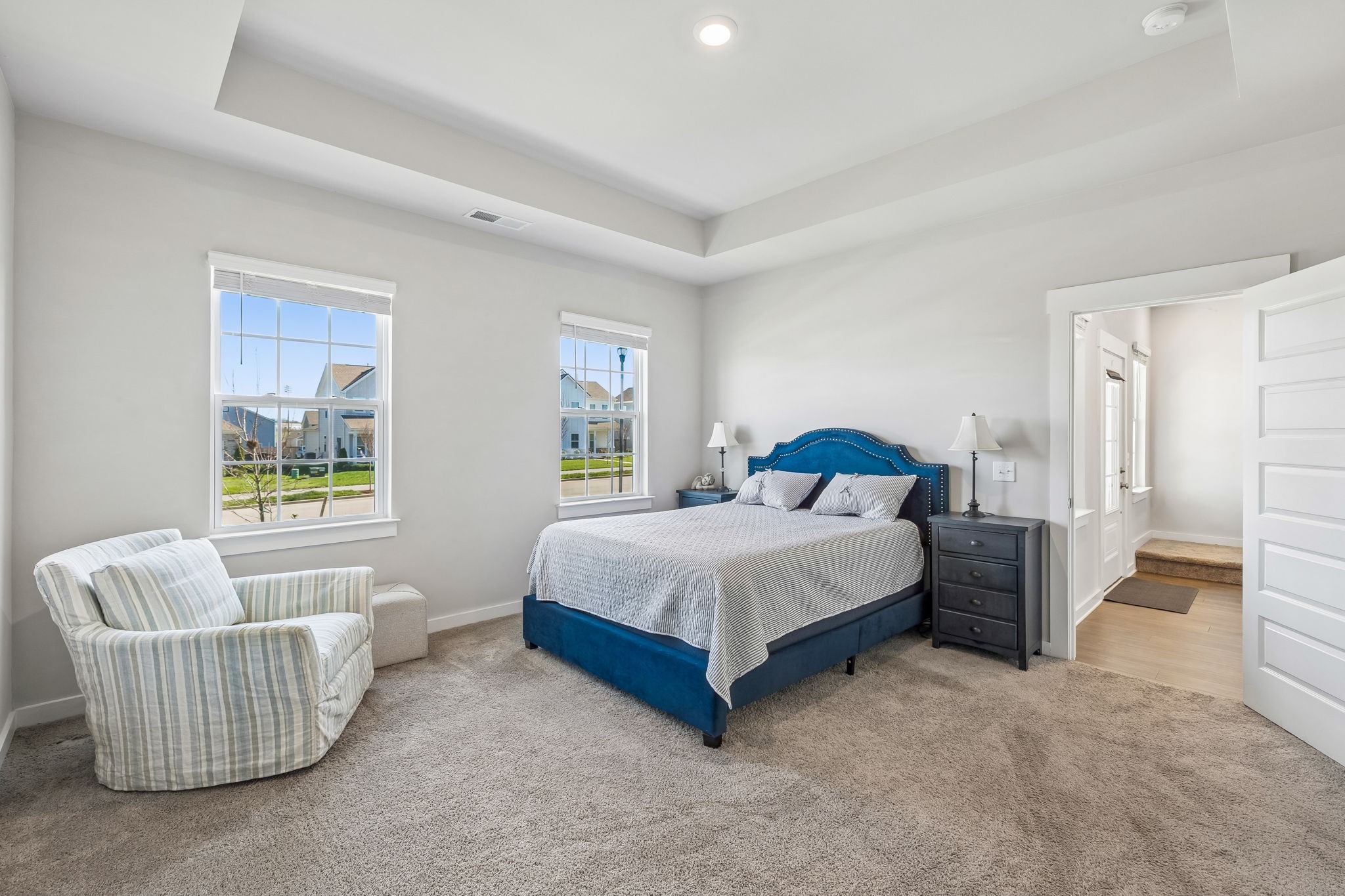 167 Harvest Point Boulevard Spring Hill, TN 37174 - Photo 29 of 55 a spacious bedroom with a bed and a couch