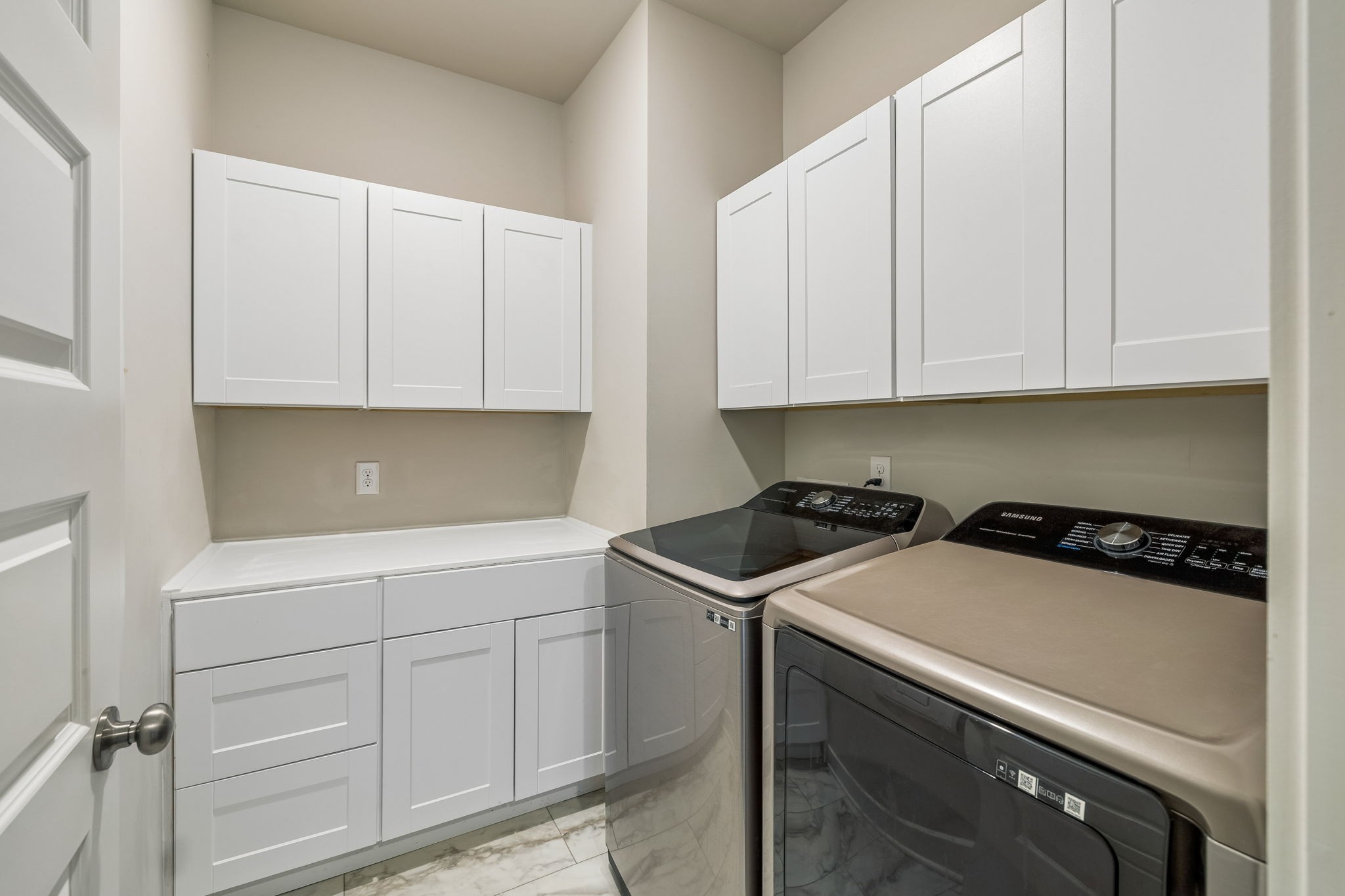 167 Harvest Point Boulevard Spring Hill, TN 37174 - Photo 35 of 55 a kitchen with white cabinets and white appliances