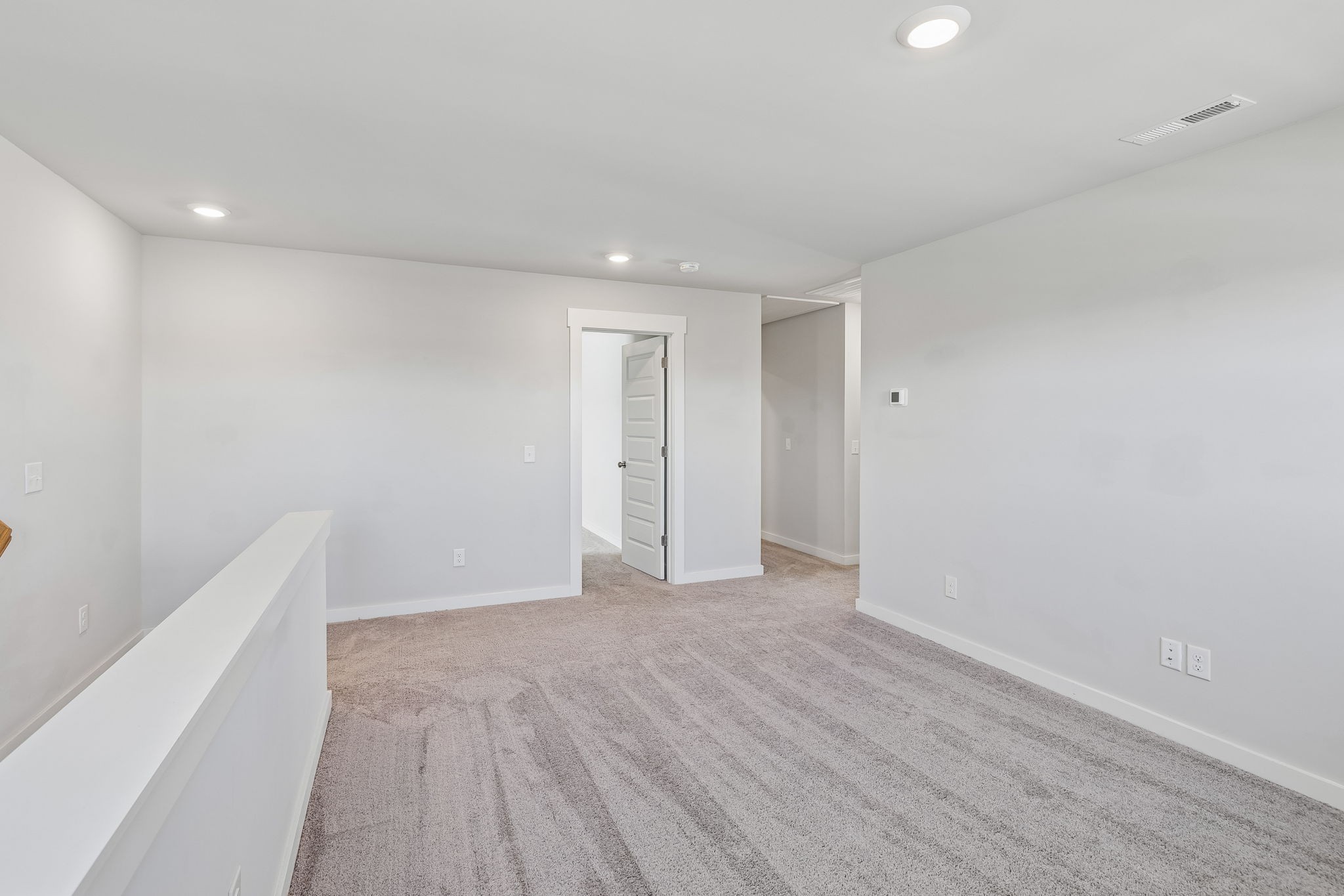 167 Harvest Point Boulevard Spring Hill, TN 37174 - Photo 38 of 55 a view of an empty room with wooden floor