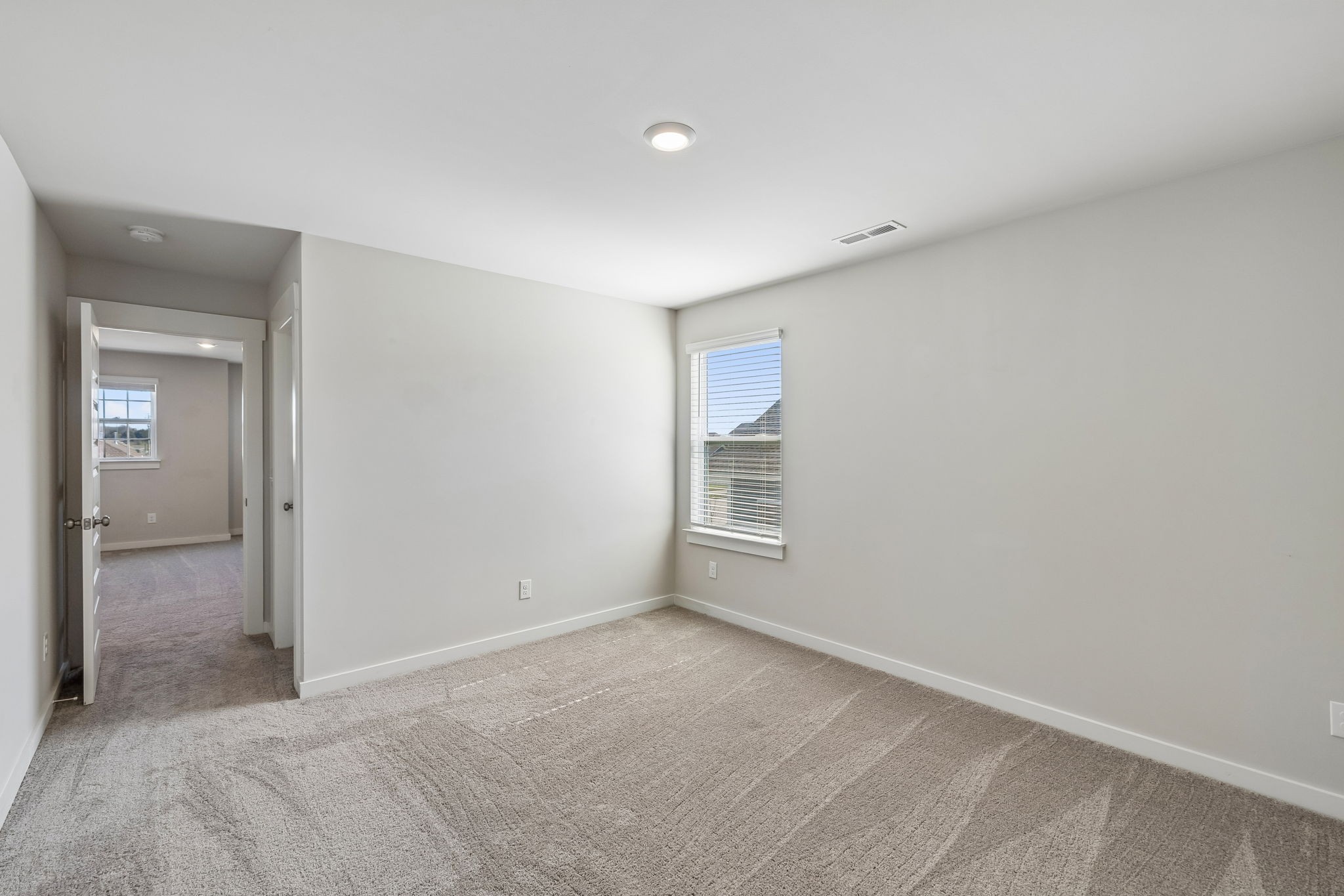 167 Harvest Point Boulevard Spring Hill, TN 37174 - Photo 40 of 55 a view of an empty room with closet and a bathroom