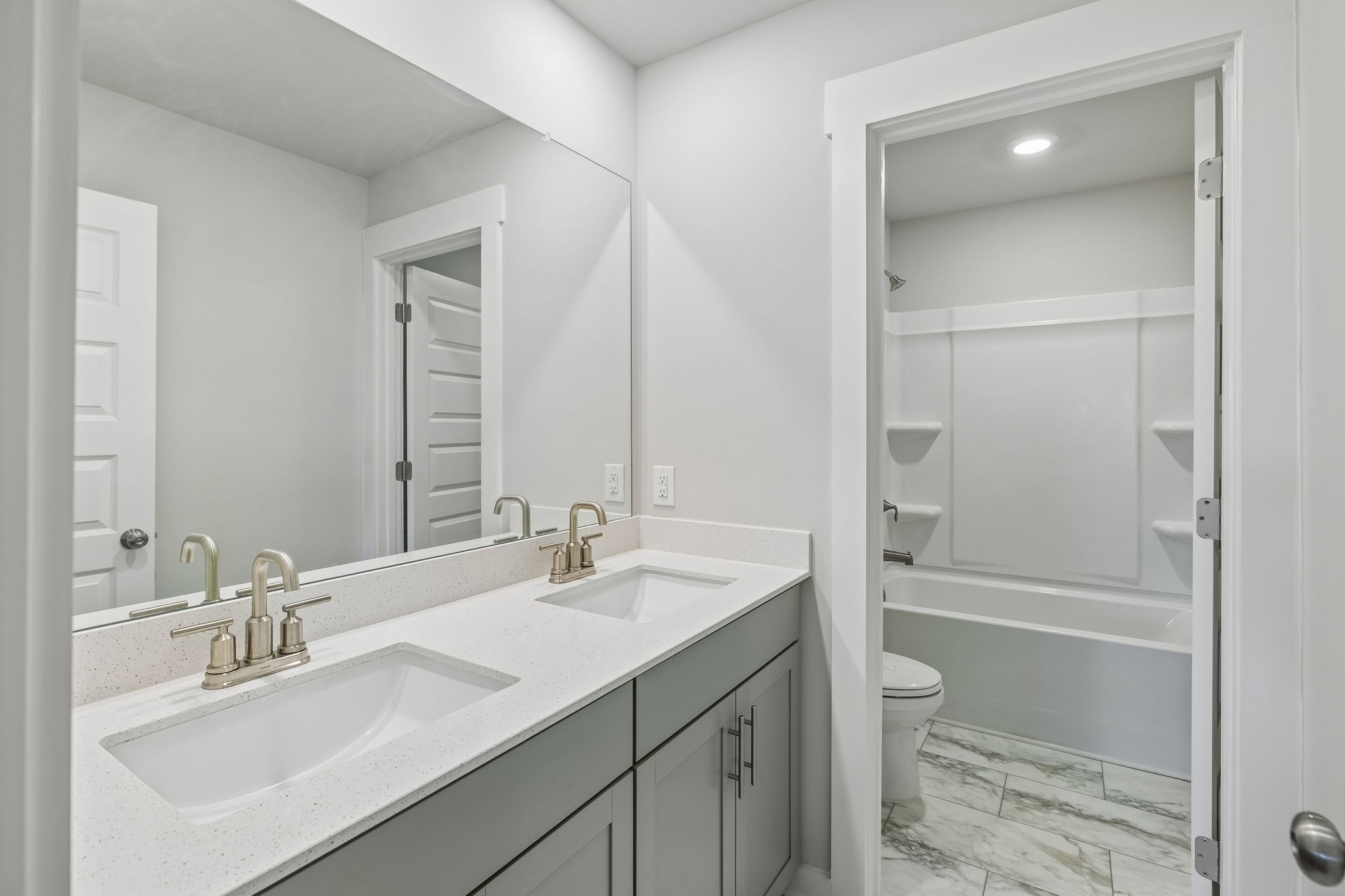167 Harvest Point Boulevard Spring Hill, TN 37174 - Photo 45 of 55 a bathroom with a sink a toilet and shower