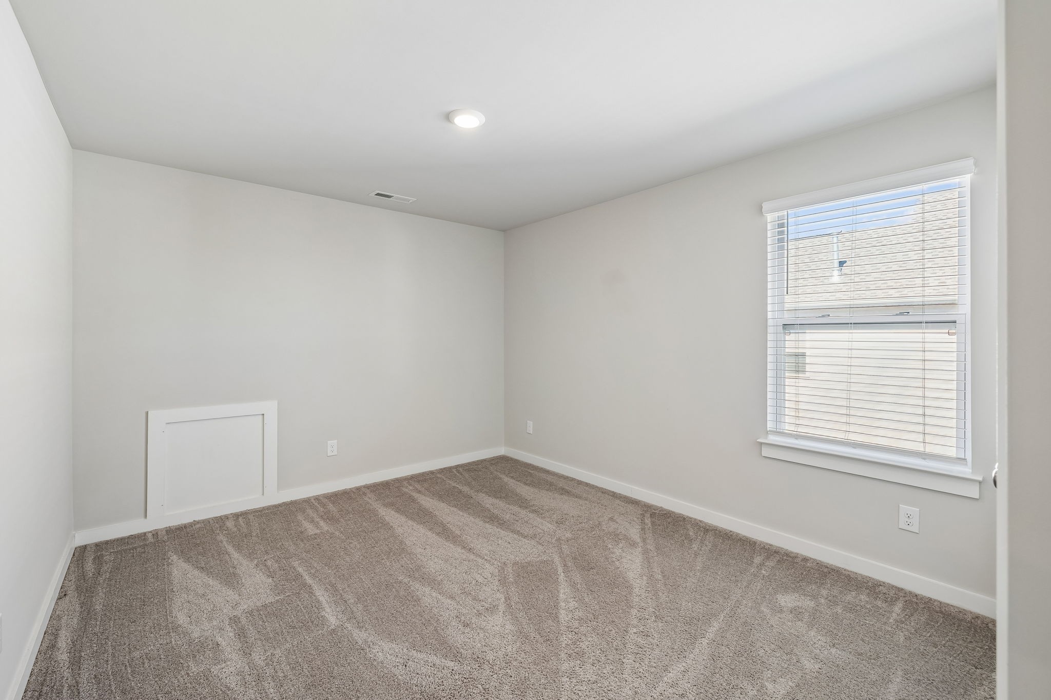 167 Harvest Point Boulevard Spring Hill, TN 37174 - Photo 47 of 55 a view of an empty room with a window