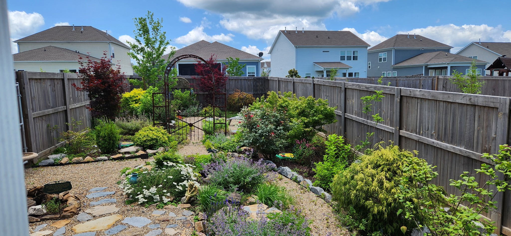 167 Harvest Point Boulevard Spring Hill, TN 37174 - Photo 49 of 55 a front view of a house with a yard and potted plants