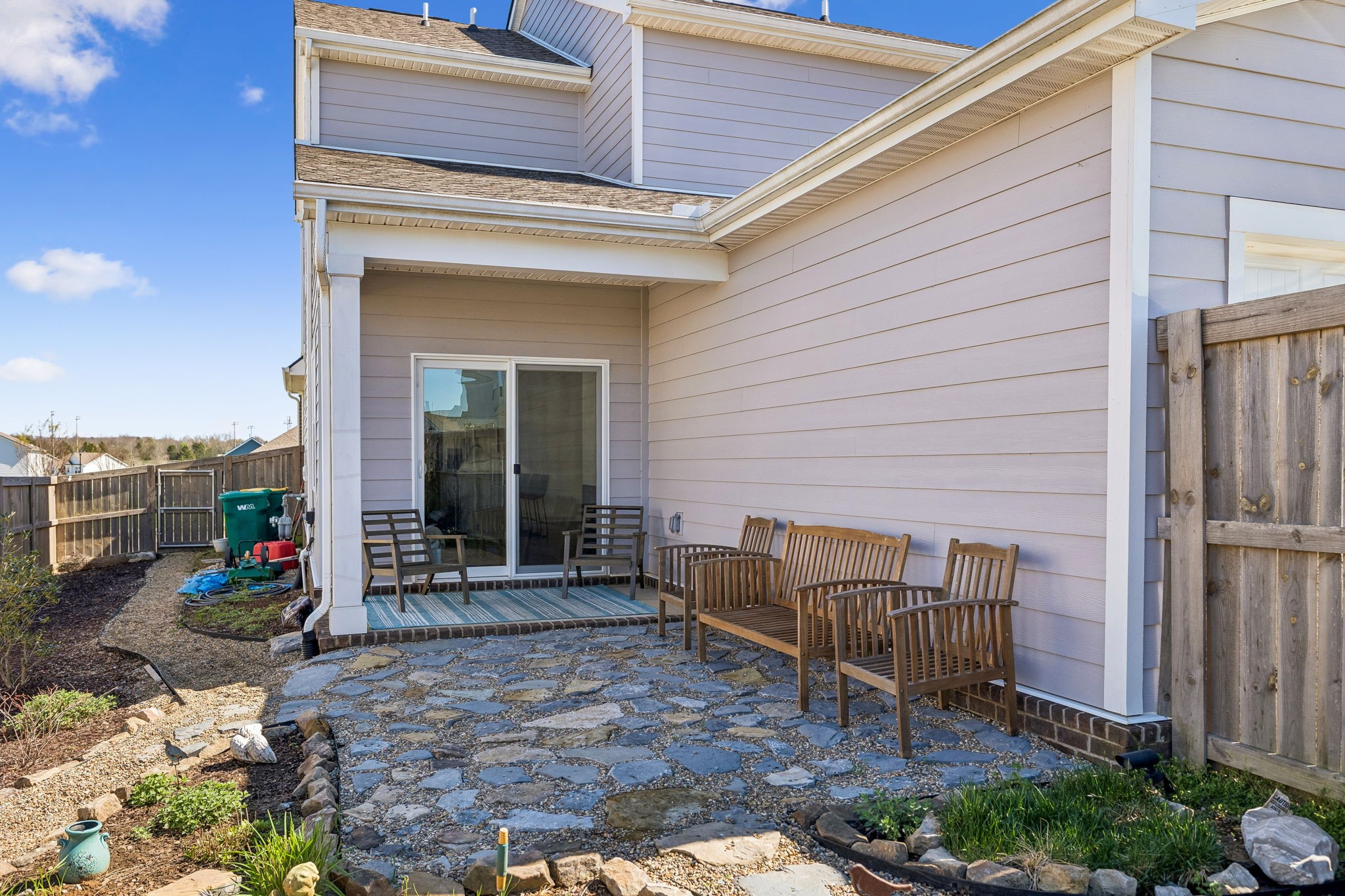 167 Harvest Point Boulevard Spring Hill, TN 37174 - Photo 53 of 55 a backyard of a house with barbeque oven table and chairs