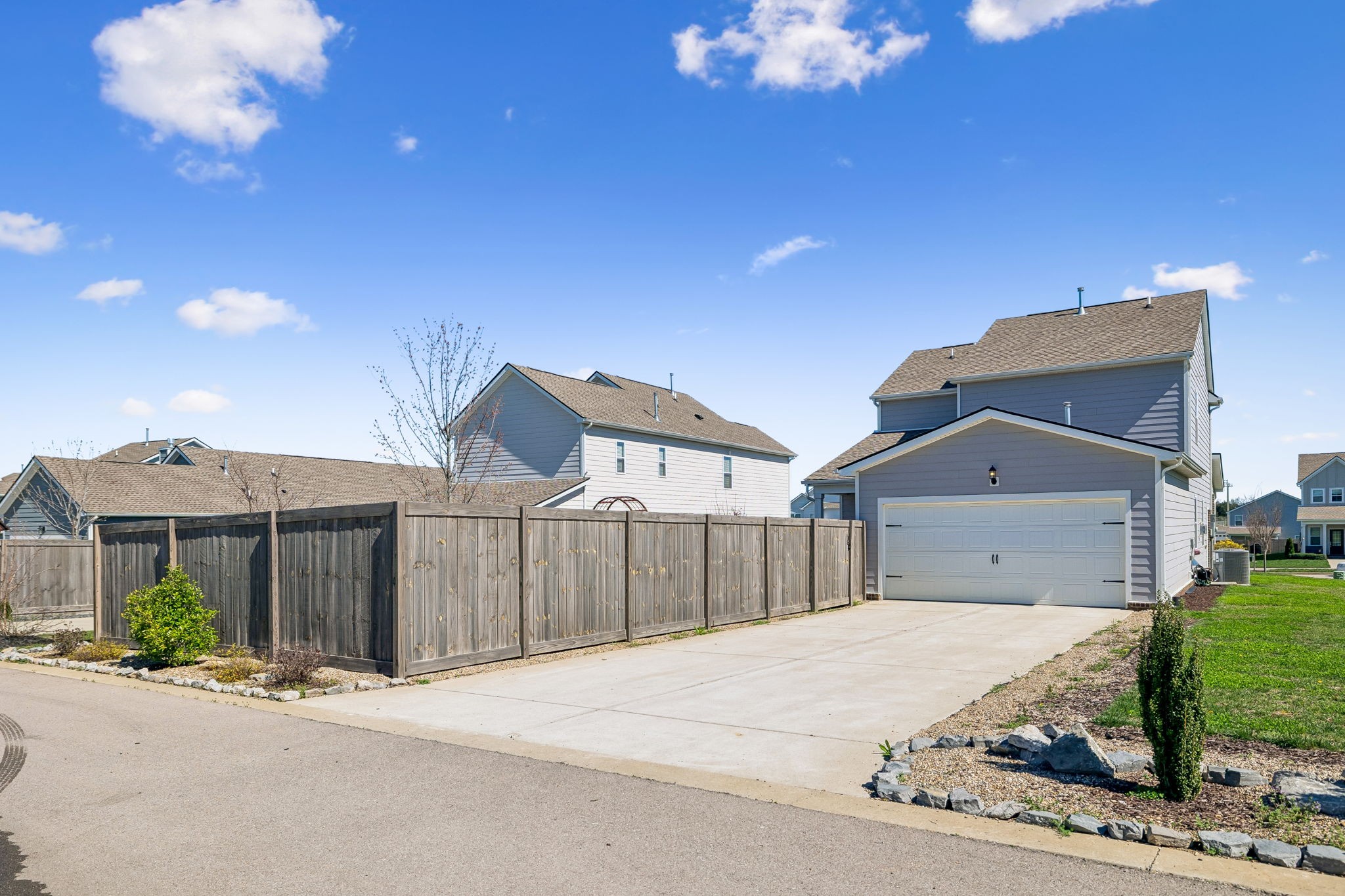 167 Harvest Point Boulevard Spring Hill, TN 37174 - Photo 55 of 55 a front view of a house with a yard and garage