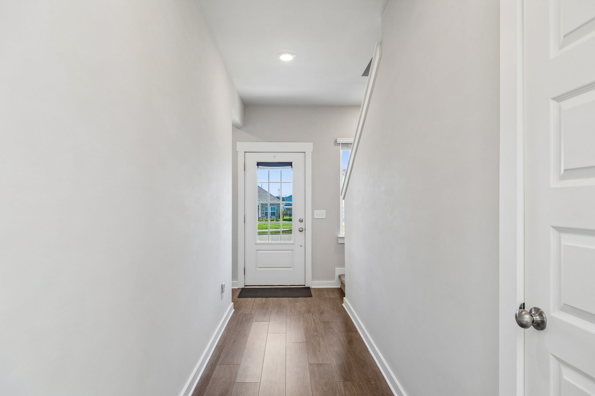 167 Harvest Point Boulevard Spring Hill, TN 37174 - Photo 8 of 55 a view of a hallway with wooden floor