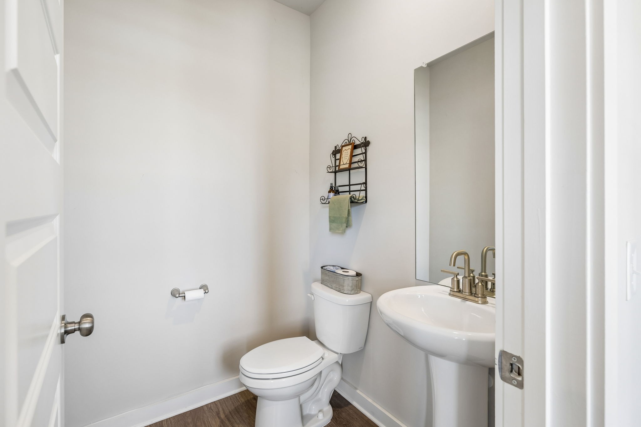 167 Harvest Point Boulevard Spring Hill, TN 37174 - Photo 10 of 55 a bathroom with a toilet and a sink