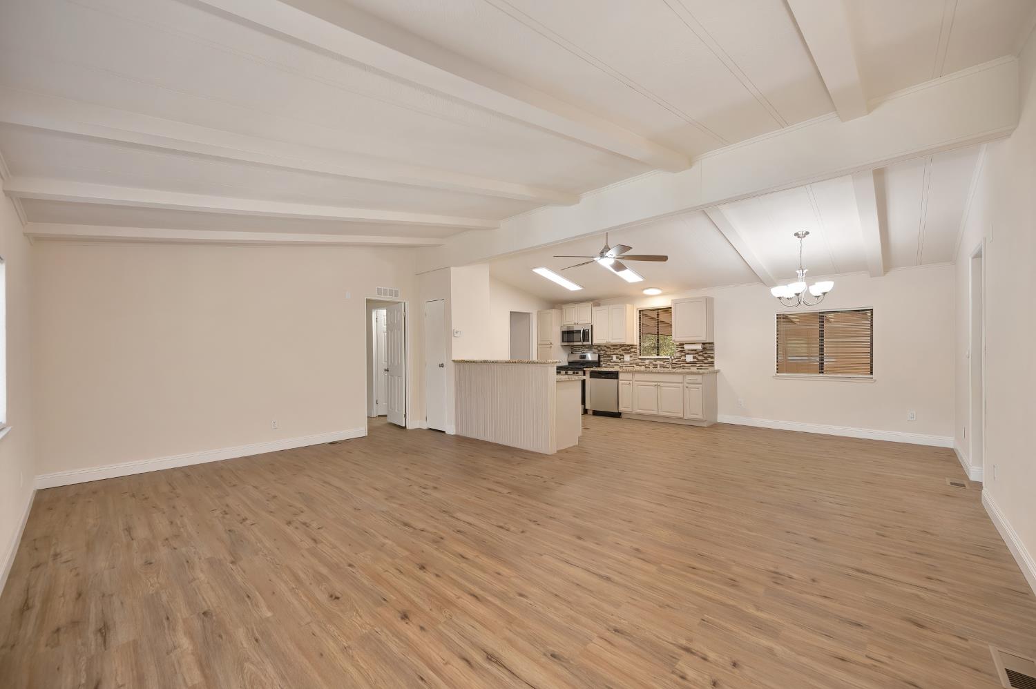 4420 Pleasant Valley Road, Unit 105 Diamond Springs, CA 95619 - Photo 11 of 33 a view of a kitchen with a sink and a refrigerator