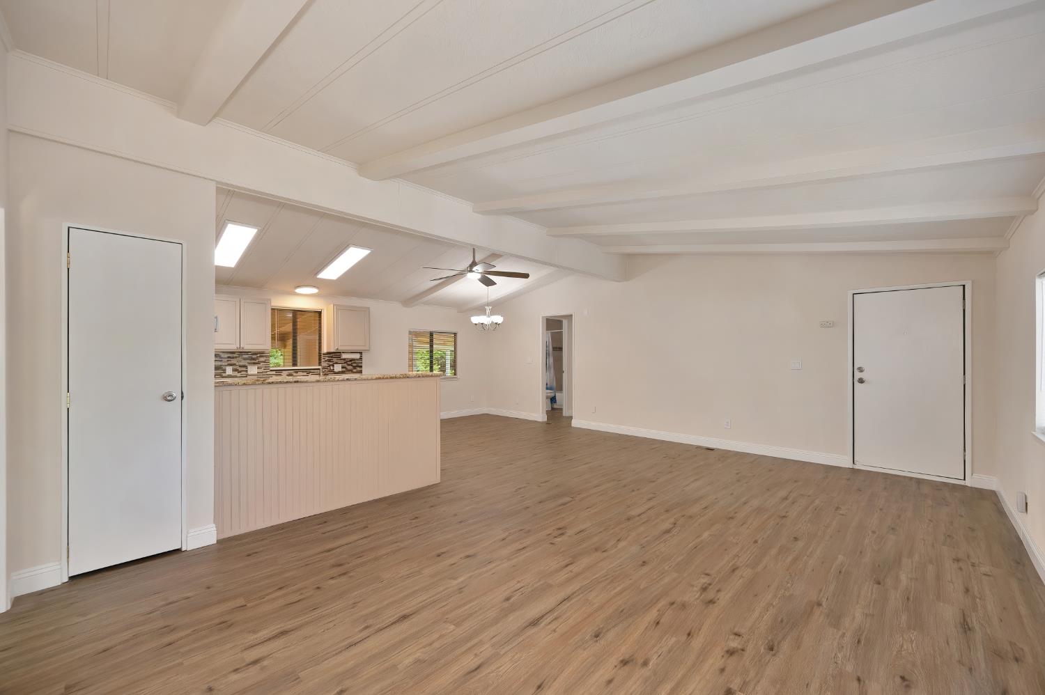 4420 Pleasant Valley Road, Unit 105 Diamond Springs, CA 95619 - Photo 14 of 33 a view of a big room with wooden floor and windows