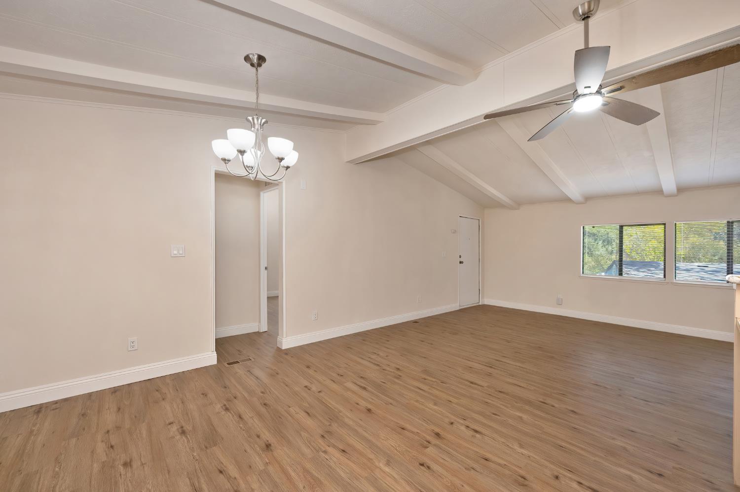 4420 Pleasant Valley Road, Unit 105 Diamond Springs, CA 95619 - Photo 17 of 33 wooden floor in an empty room with a window