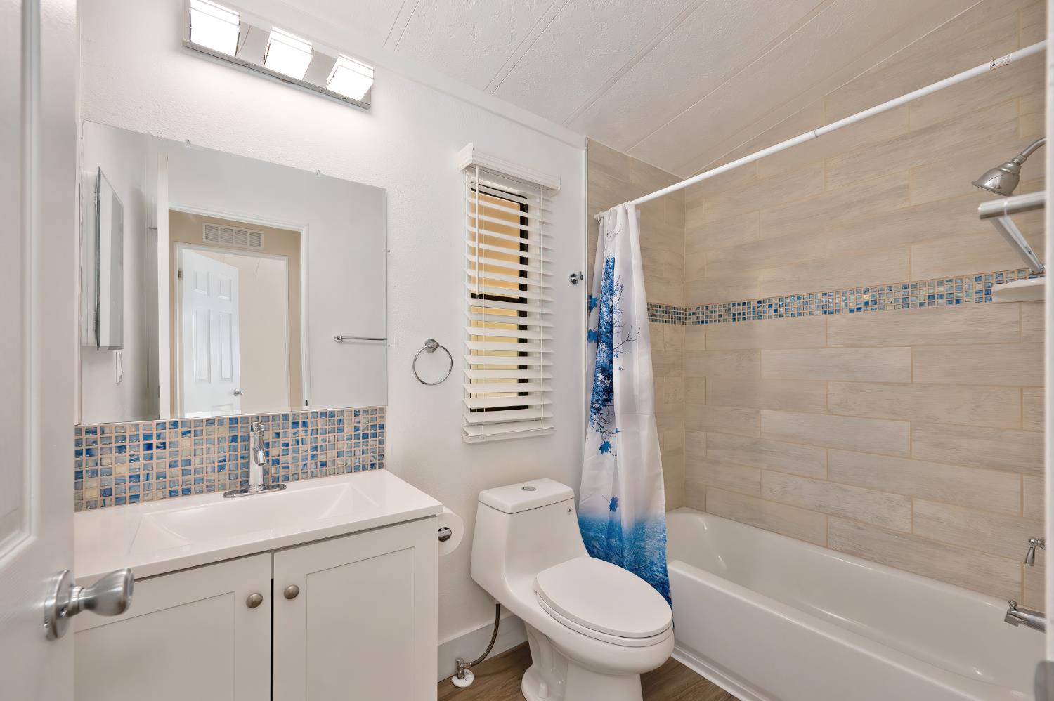 4420 Pleasant Valley Road, Unit 105 Diamond Springs, CA 95619 - Photo 18 of 33 a bathroom with a sink toilet and shower