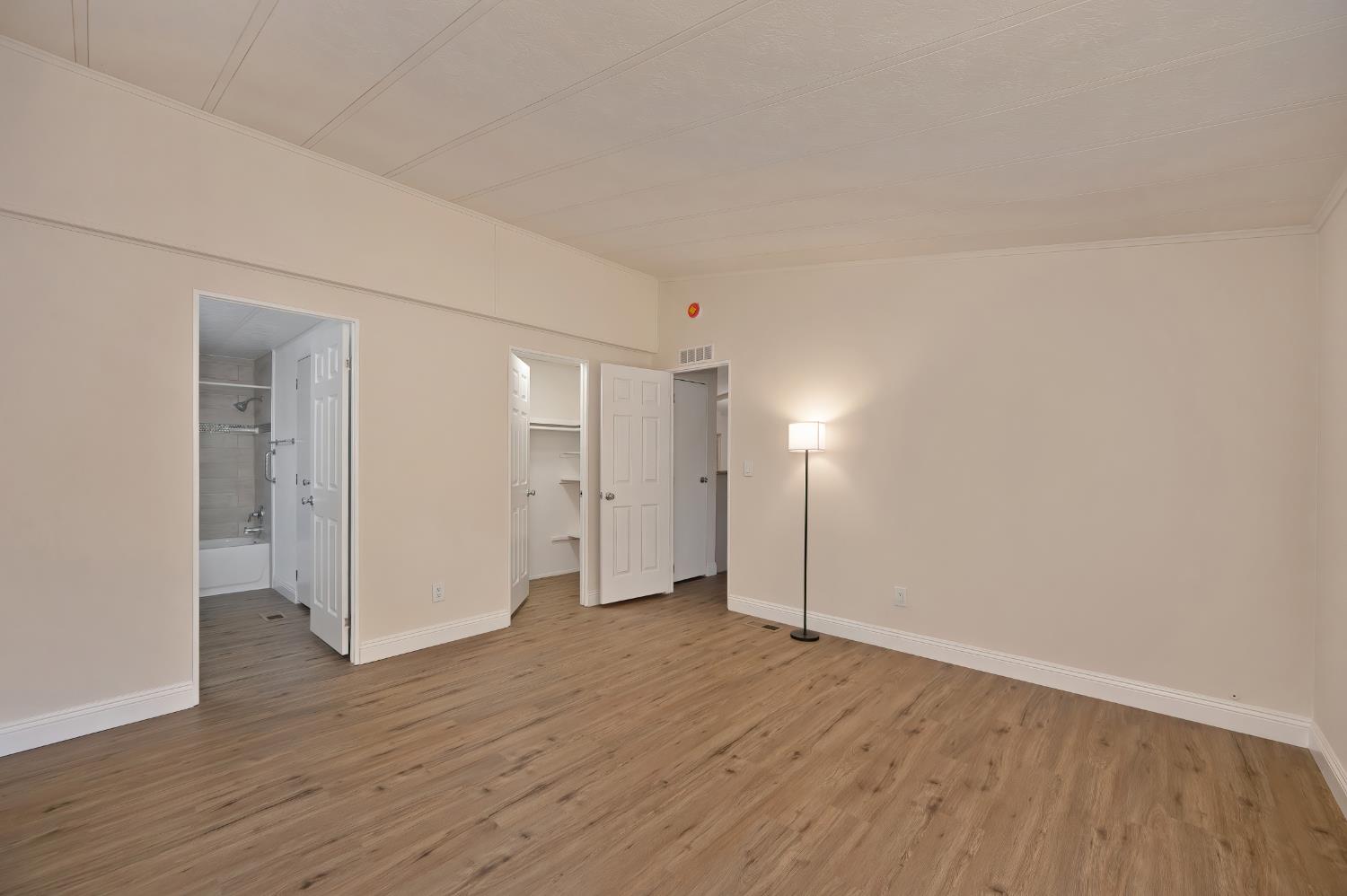 4420 Pleasant Valley Road, Unit 105 Diamond Springs, CA 95619 - Photo 22 of 33 a view of empty room with wooden floor