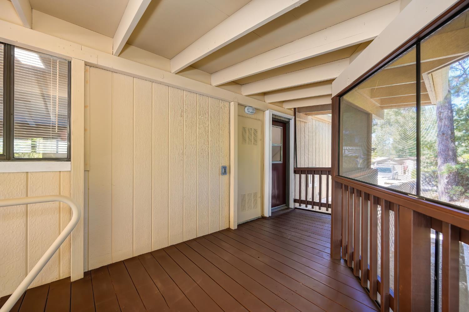 4420 Pleasant Valley Road, Unit 105 Diamond Springs, CA 95619 - Photo 33 of 33 a view of a hallway with wooden floor and windows