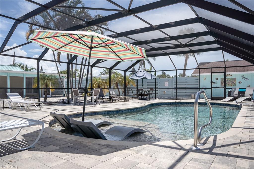 509 Shore Road Nokomis, FL 34275 - Photo 11 of 50 a view of a swimming pool with a patio