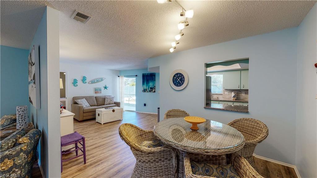 509 Shore Road Nokomis, FL 34275 - Photo 26 of 50 a living room with furniture and a mirror