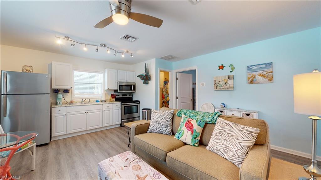 509 Shore Road Nokomis, FL 34275 - Photo 29 of 50 a living room with furniture and kitchen view