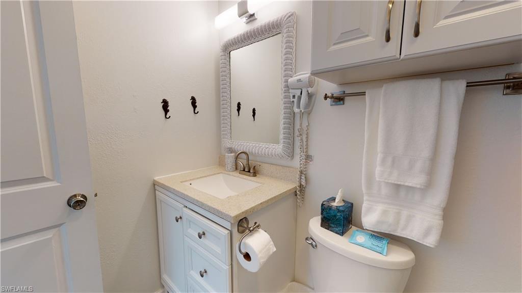 509 Shore Road Nokomis, FL 34275 - Photo 30 of 50 a bathroom with a sink a toilet and shower