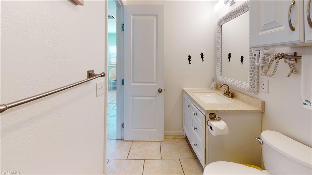 509 Shore Road Nokomis, FL 34275 - Photo 33 of 50 a bathroom with a sink a toilet and shower