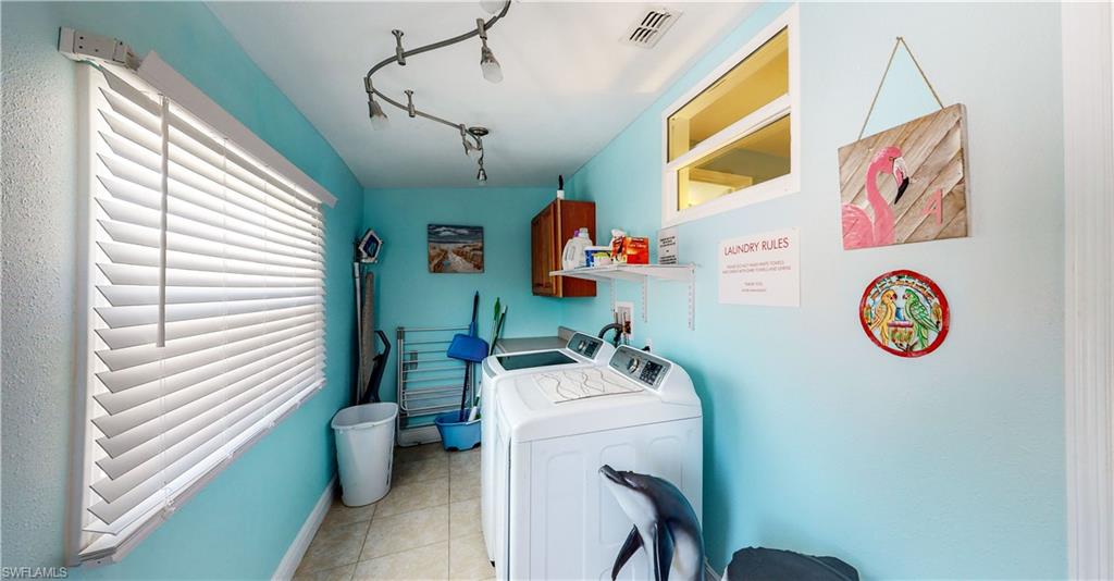 509 Shore Road Nokomis, FL 34275 - Photo 36 of 50 a utility room with a window dryer and washer