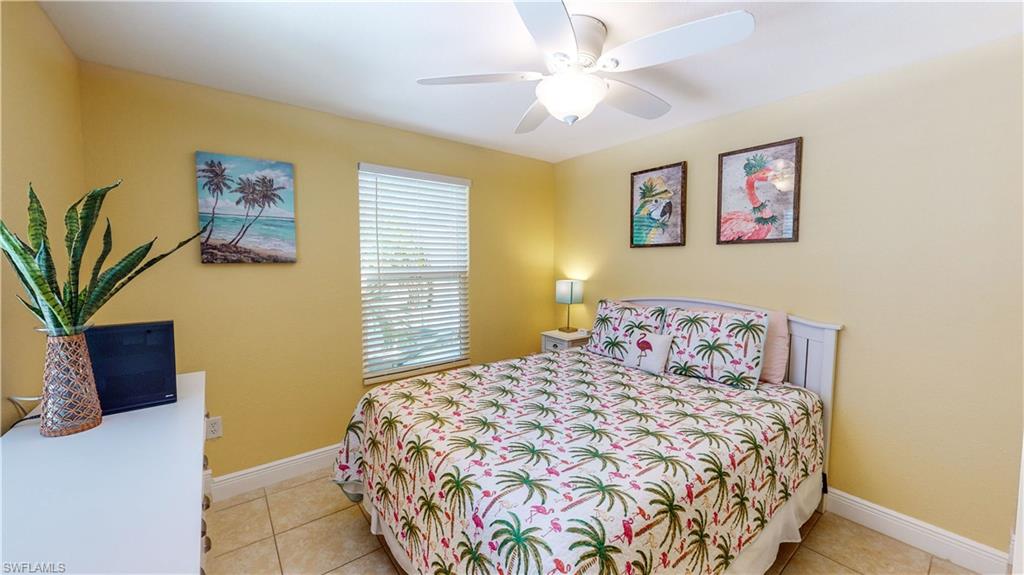 509 Shore Road Nokomis, FL 34275 - Photo 38 of 50 a bedroom with a bed and a painting on the wall