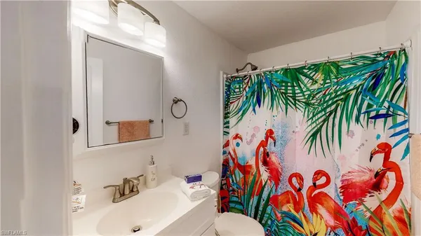 a bathroom with a sink double vanity and tub