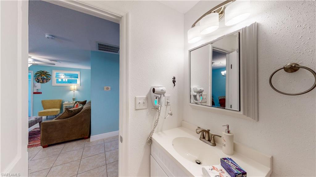 509 Shore Road Nokomis, FL 34275 - Photo 41 of 50 a bathroom with a sink double vanity and tub