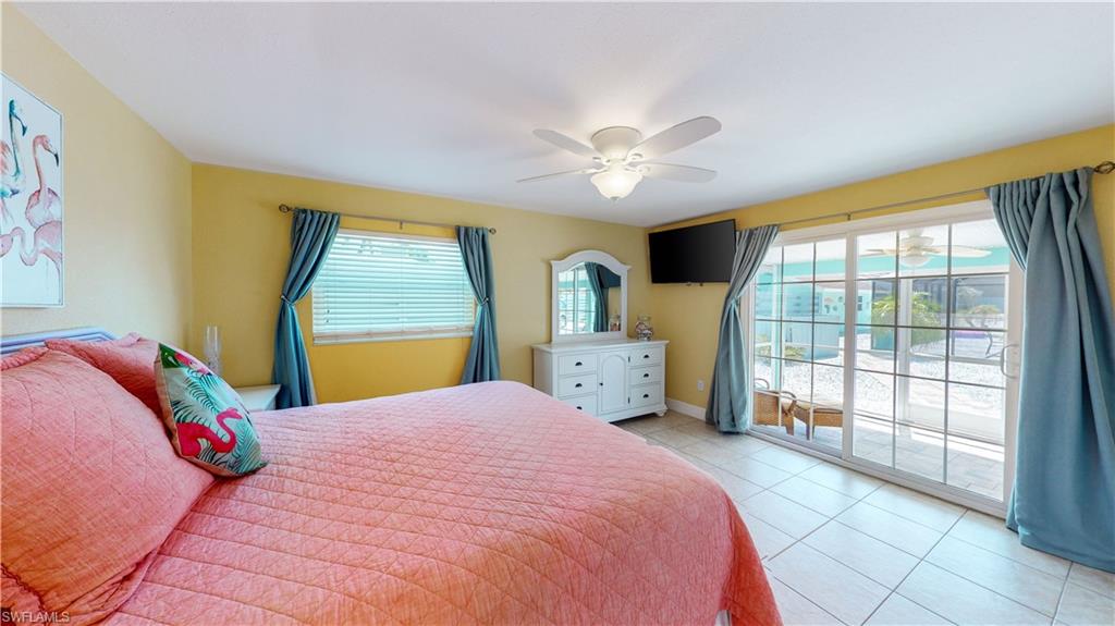 509 Shore Road Nokomis, FL 34275 - Photo 42 of 50 a bedroom with a large bed and a large window