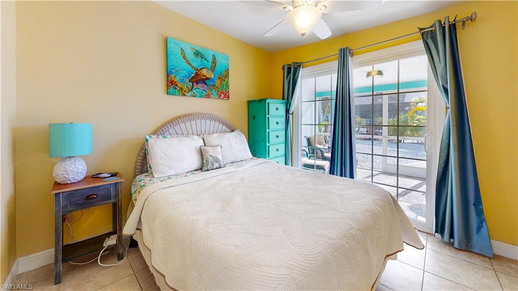 509 Shore Road Nokomis, FL 34275 - Photo 49 of 50 a bedroom with a bed and a window