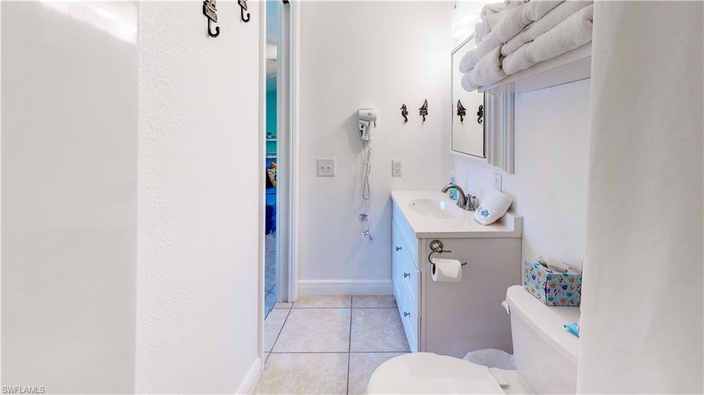 509 Shore Road Nokomis, FL 34275 - Photo 50 of 50 a bathroom with a sink toilet and shower