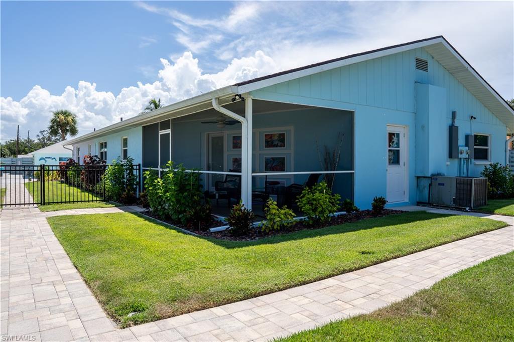 509 Shore Road Nokomis, FL 34275 - Photo 9 of 50 a view of a house with backyard and garden