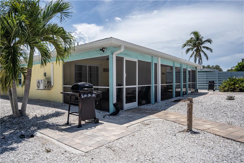 509 Shore Road Nokomis, FL 34275 - Photo 10 of 50 a view of a house with backyard porch and sitting area