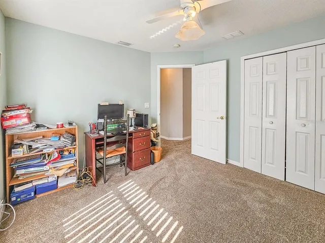 a bed room with a bed and a tv