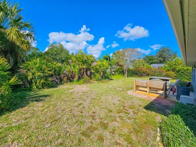 a view of a golf course with chairs