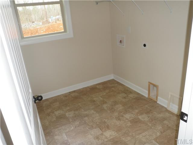 4854 Inwood Road Raleigh, NC 27603 - Photo 10 of 20 Large walk in laundry room on the first floor