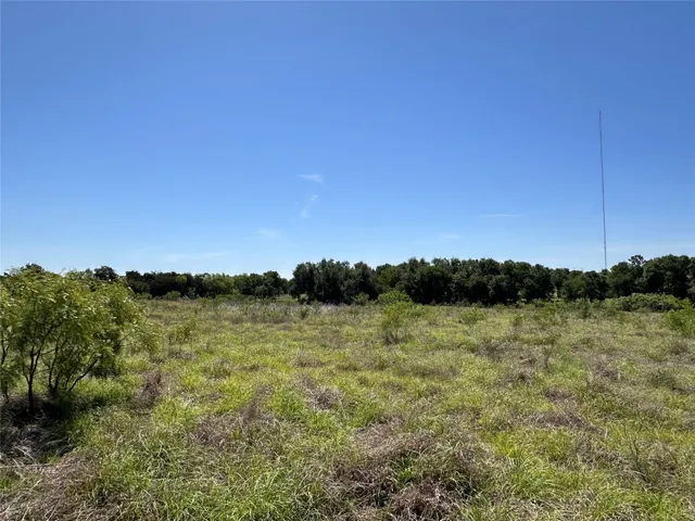 a view of a lake next to a yard
